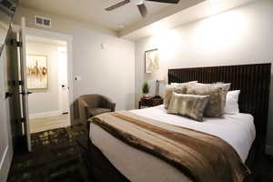 Bedroom featuring dark wood-style flooring and ceiling fan