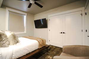 Bedroom with a ceiling fan and a closet