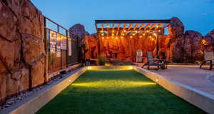 View of yard featuring a patio, a mountain view, and a pergola