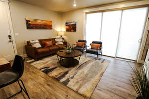 Living room with wood finished floors and recessed lighting
