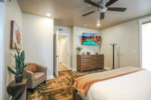 Bedroom featuring a ceiling fan, recessed lighting, and carpet floors