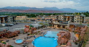 Community pool featuring a patio, a mountain view, and a pergola