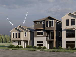 View of front facade featuring a balcony and brick siding