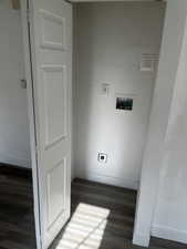 Laundry room featuring hookup for a washing machine, dark wood-style flooring, and hookup for an electric dryer