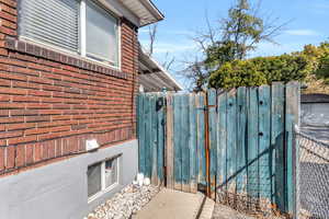 Exterior view of a gate and brick siding