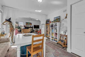 Dining room featuring wood finished floors and arched walkways