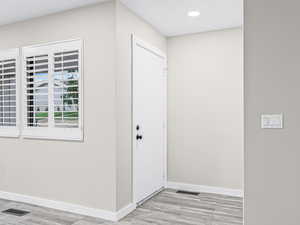 Entrance foyer featuring light wood-style flooring and recessed lighting