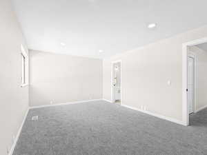 Spare room with carpet flooring and recessed lighting