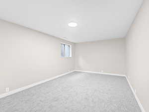 Spare room with carpet flooring and baseboards
