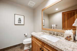 Bathroom featuring vanity, recessed lighting