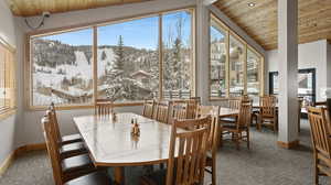 Sunroom/dining room featuring a mountain view of the ski trails, seasonal breakfast buffet and apres ski is included for all owners and guests of Trails End, one of the great perks of owning here
