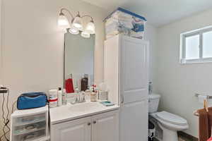 Half bath with vanity and toilet