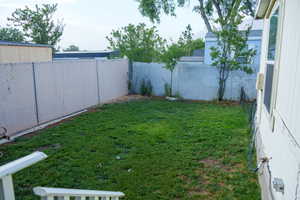 View of fenced backyard