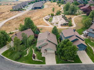 Aerial view of property's location with nearby suburban area