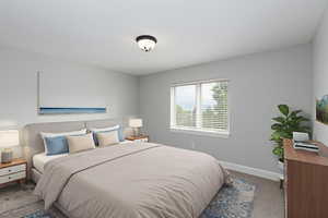 Bedroom featuring baseboards and carpet