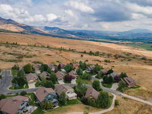 Aerial view of residential area featuring mountains