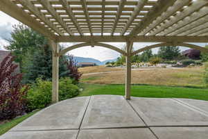 View of patio featuring a mountain view and a pergola