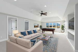 Carpeted living area with billiards, a raised ceiling, recessed lighting, and ceiling fan