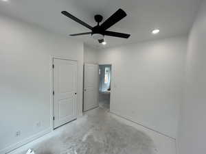 Bedroom  2 with unfinished concrete flooring, recessed lighting, and a ceiling fan