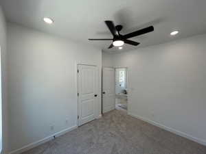 Unfurnished bedroom featuring carpet flooring, recessed lighting, a ceiling fan, and a textured ceiling