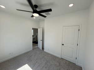 Unfurnished bedroom featuring recessed lighting, carpet flooring, and a ceiling fan