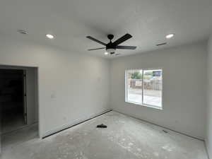 Master Bedroom featuring ceiling fan, recessed lighting, and a textured ceiling