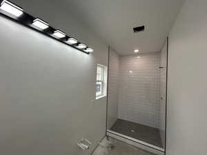 Master bathroom featuring a stall shower and recessed lighting