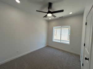 Unfurnished room featuring carpet flooring, ceiling fan, and recessed lighting