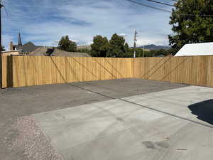 New Fence and 2 car parking pad in back of home.