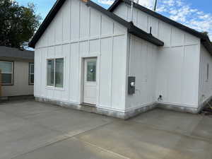 Back of property featuring board and batten siding