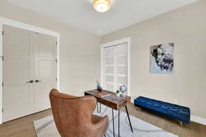 Home office with wood finished floors