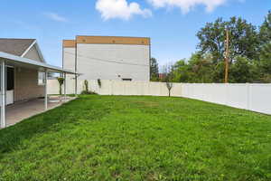 Fenced backyard featuring a patio area