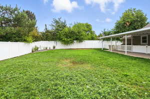 View of fenced backyard