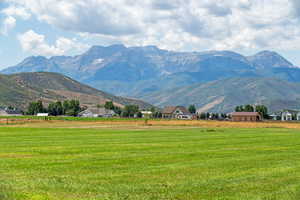 View of mountain backdrop featuring rural landscape