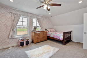 Bedroom featuring carpet flooring, recessed lighting, a ceiling fan, a textured ceiling, and vaulted ceiling