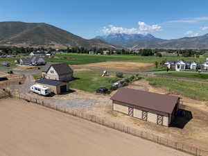 Overview of rural landscape with a mountain backdrop