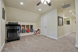 Playroom featuring recessed lighting, lofted ceiling, light colored carpet, and a ceiling fan