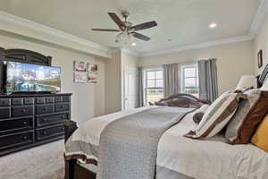 Bedroom with crown molding, light colored carpet, a ceiling fan, a textured ceiling, and recessed lighting