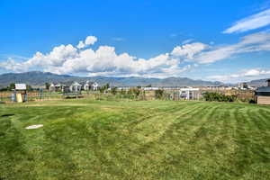 View of yard featuring a mountain view and a playground
