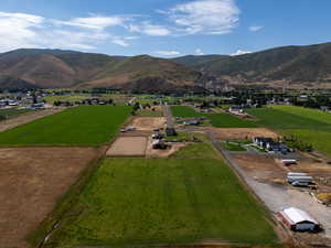 Aerial overview of property's location featuring rural landscape and mountains