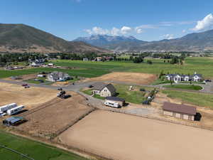 Aerial view of sparsely populated area featuring a mountainous background
