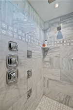 Full bath with a tile shower