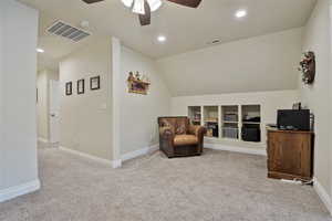 Sitting room with vaulted ceiling, recessed lighting, light carpet, and a ceiling fan