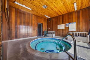 View of pool featuring an in-ground hot tub
