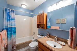 Full hallway bathroom with shower / tub combo