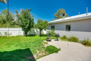View of yard with a patio
