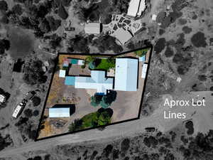 Aerial view of property and surrounding area with property parcel outlined