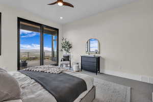 Carpeted bedroom with access to outside, multiple windows, a mountain view, ceiling fan, and recessed lighting