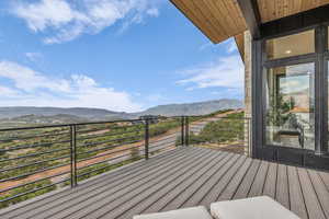 Wooden deck featuring a mountain view