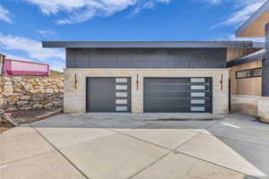 Garage with concrete driveway